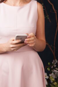 Woman searching phone for answers to the question: can I rely on government pensions for retirement?